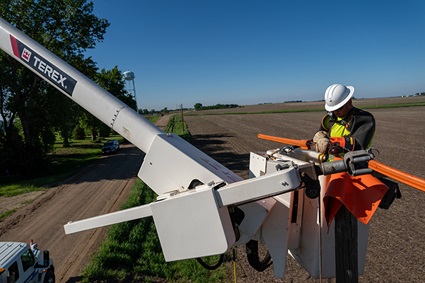 Lineman working on a power line in a Terex bucket truck