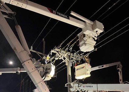 Lineworkers restoring power in Terex bucket trucks