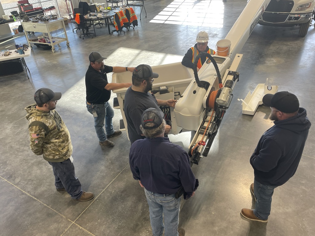 Participants of a Terex Maintenance Workshop learn about the components of a Terex bucket truck