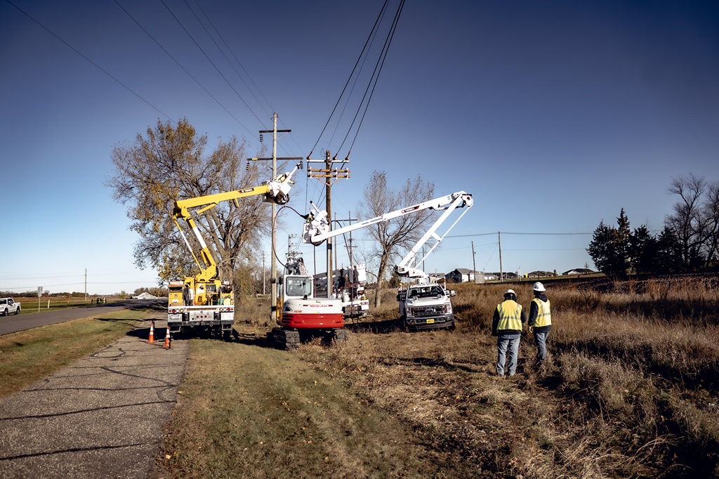 Utility crews working in Terex bucket trucks