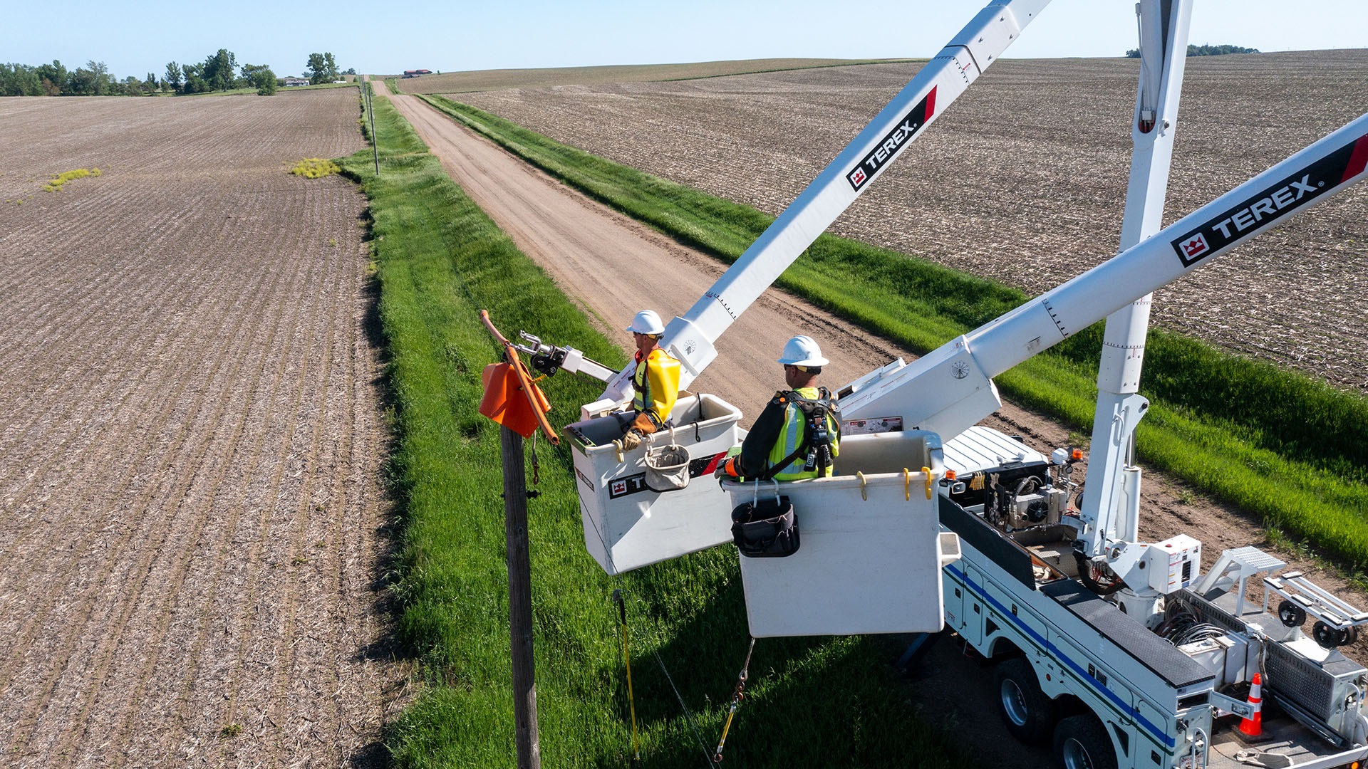 Utility crew working in Terex bucket trucks