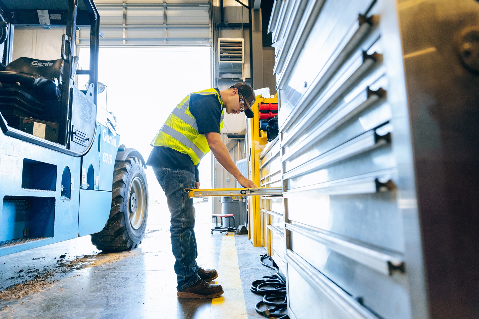 Terex technician looking in tool cabinet