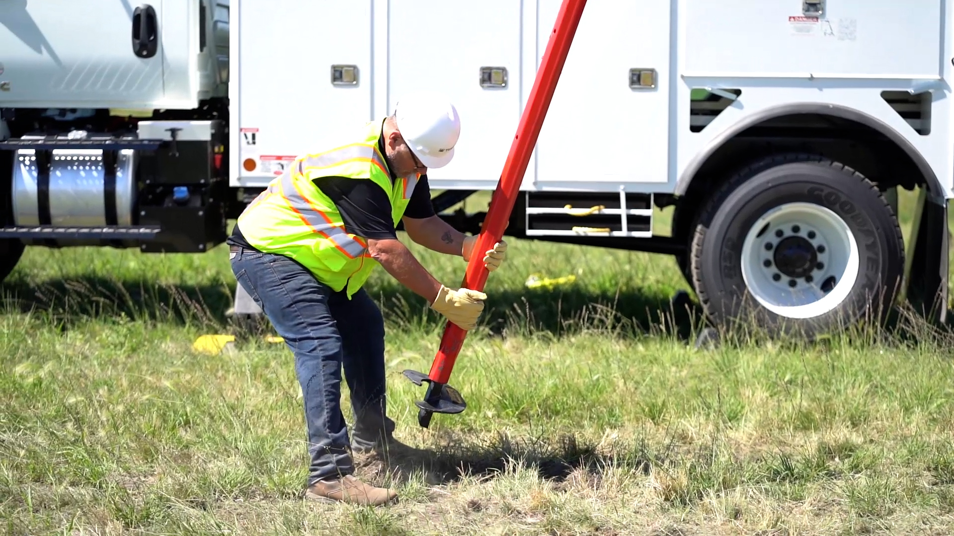 Utility worker installing screw anchor with Terex Hollow Kelly Bar