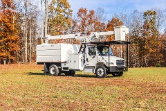 Terex XT Pro 60-70 bucket truck parked in forest