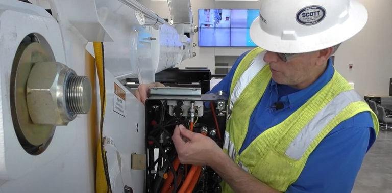 Terex technician working on Terex bucket truck hydraulics